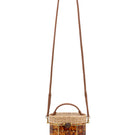 Waiwai Rio Copan turtle top handle bag in vibrant green with textured finish and sturdy handles.