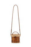 Waiwai Rio Copan turtle top handle bag in vibrant green with textured finish and sturdy handles.