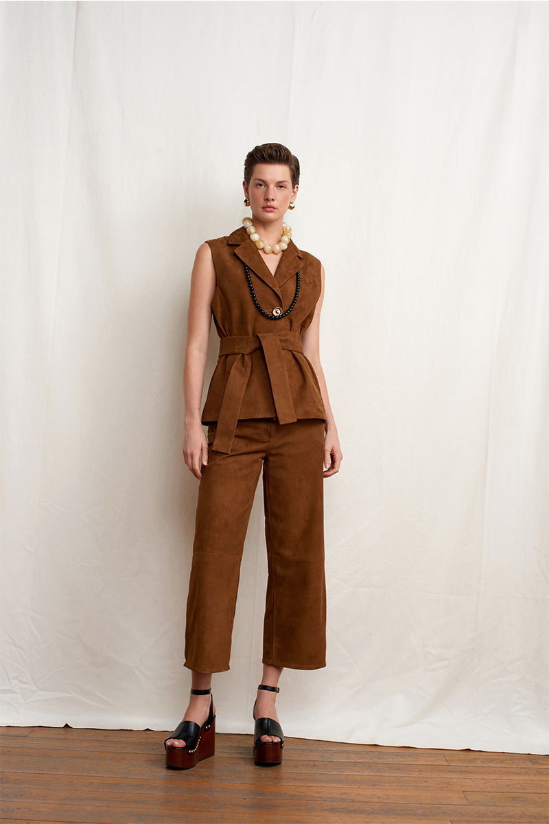 Acaria Studio brown suede pants, stylish and comfortable, shown on a model with a relaxed fit and classic design.