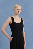 Black asymmetric-beck sleeveless jumpsuit by JINSUN, featuring a stylish one-shoulder design and fitted silhouette.