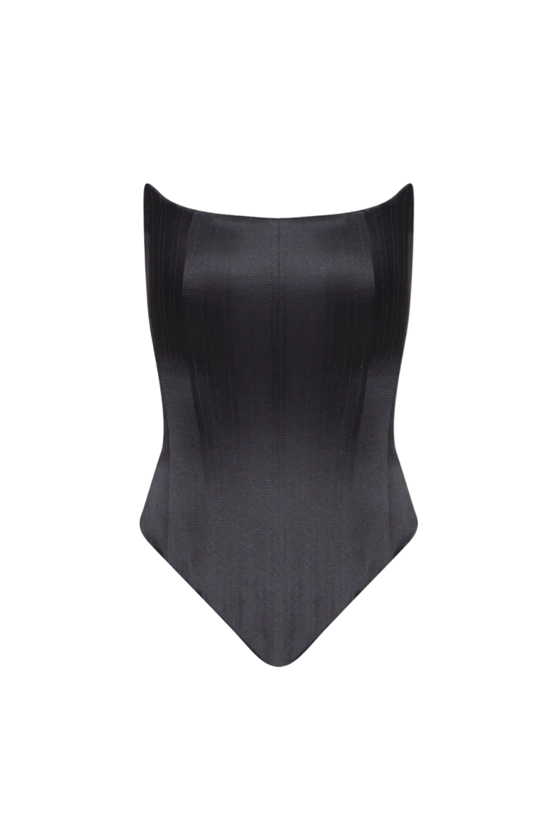 BALYKINA angled two-sided corset top showing black and beige fabric with structured design and adjustable straps.