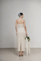 White Plan LANLOLA maxi dress with flowing fabric and sleeveless design, perfect for summer or casual occasions.