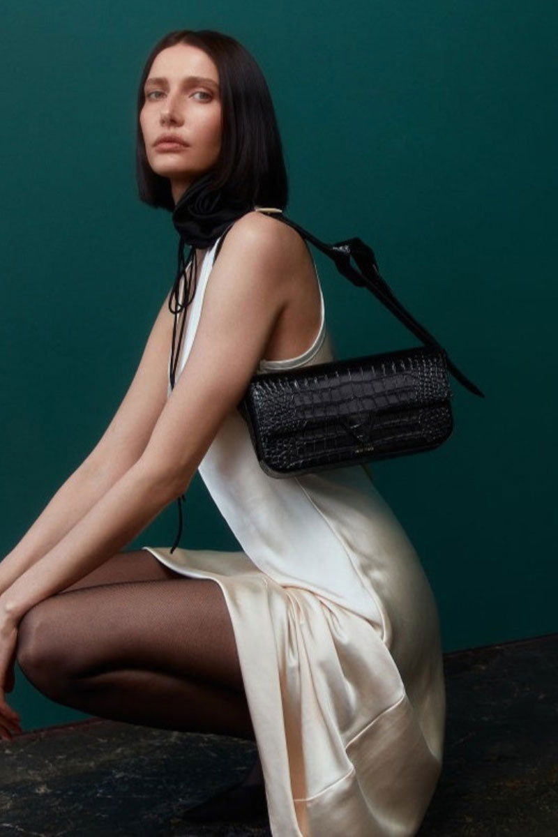 Black croco leather Katrine shoulder bag by Vikele Studio, showcasing its textured crocodile pattern and elegant design.
