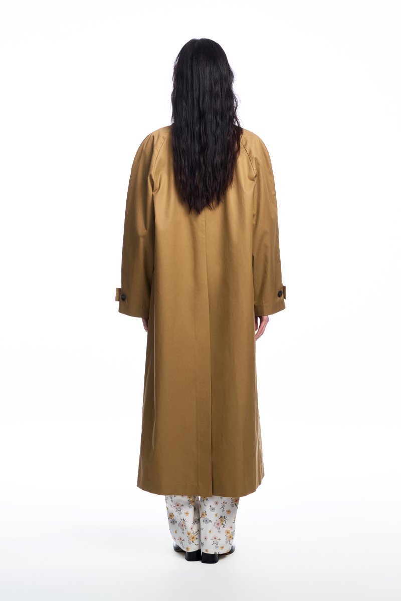 Long brown trench coat with a collar from Chictopia, shown hanging on a wooden hanger with a classic design.
