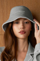 Gray Shell women's silk wool bucket hat by MANITO, featuring a soft, stylish design with a wide brim and cozy texture.