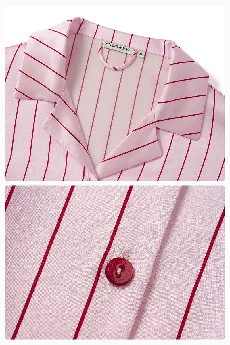 Pink striped silk pajama set by Not Just Pajama featuring a long-sleeve top and matching pants from the Museum of Crush collection.