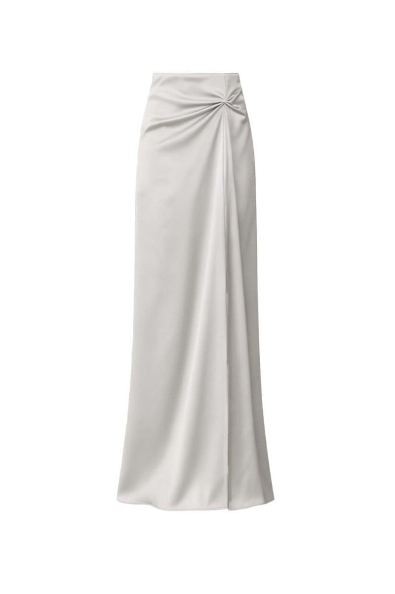 Nazlı Ceren Corinne satin maxi skirt in silver lining with smooth fabric and elegant flow, shown on a model.