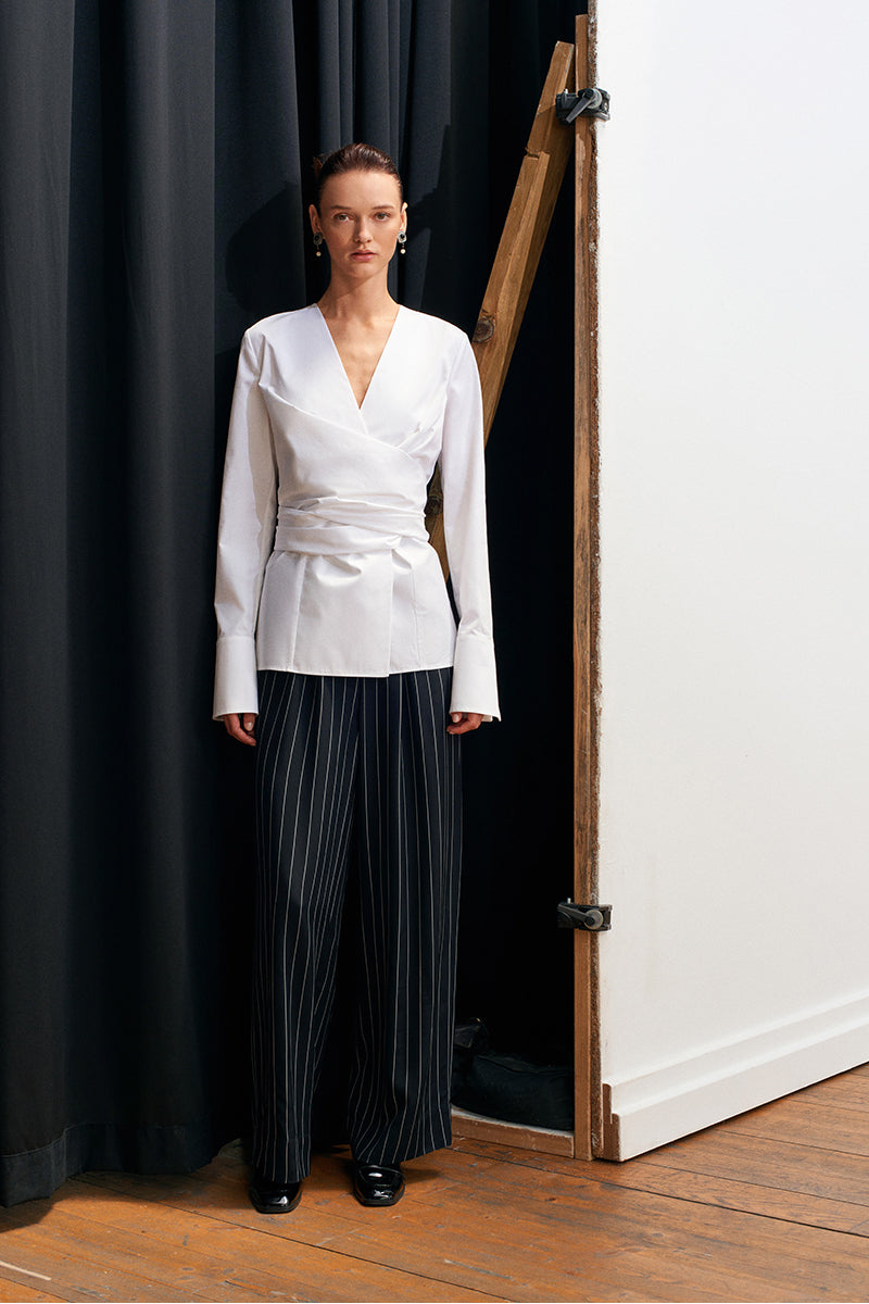 Acaria Studio Journey Shirt featuring a stylish, casual design with a comfortable fit, displayed on a hanger.