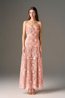 Pink floral strapless maxi dress by I.H.F Studio with an A-line silhouette, featuring a fitted bodice and flowing skirt.
