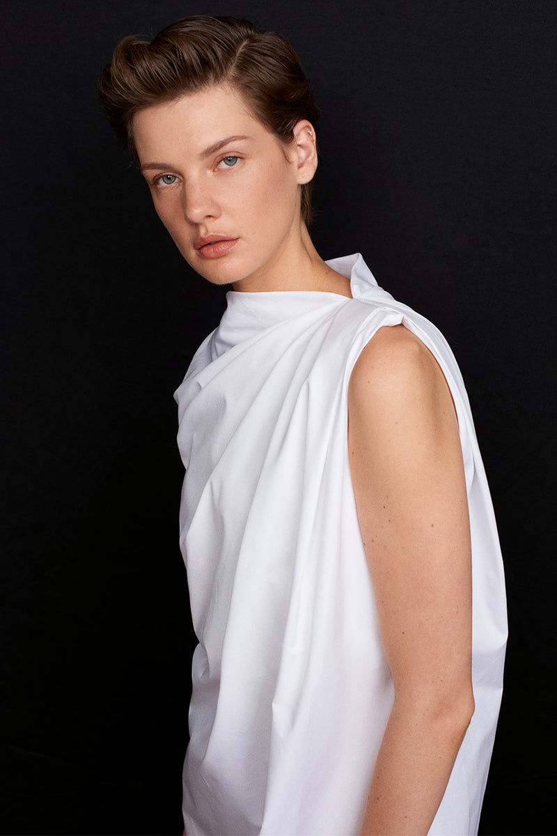 Acaria Studio Roma mini dress in vibrant fabric, sleeveless design, fitted silhouette, and stylish neckline.