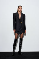 Black Rotten mini skirt by Acaria Studio, featuring a fitted design and stylish look, shown on a model.