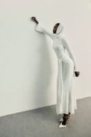 White Keli maxi dress by Khanum's, flowing fabric, sleeveless design, and elegant style perfect for summer or casual wear.