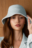 Blue Shell Women’s Silk Wool Bucket Hat by MANITO featuring a soft, stylish brim and classic bucket hat design.