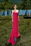 Pink off-shoulder pleated gown by Le Thanh Hoa featuring elegant design and flowing fabric, perfect for formal occasions.