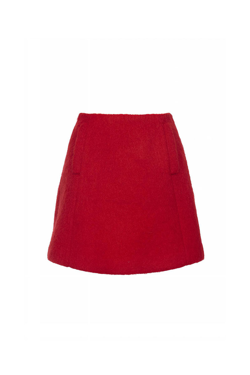 Chictopia Phoebe mini skirt in black with subtle pleats, displayed on a hanger against a neutral background.