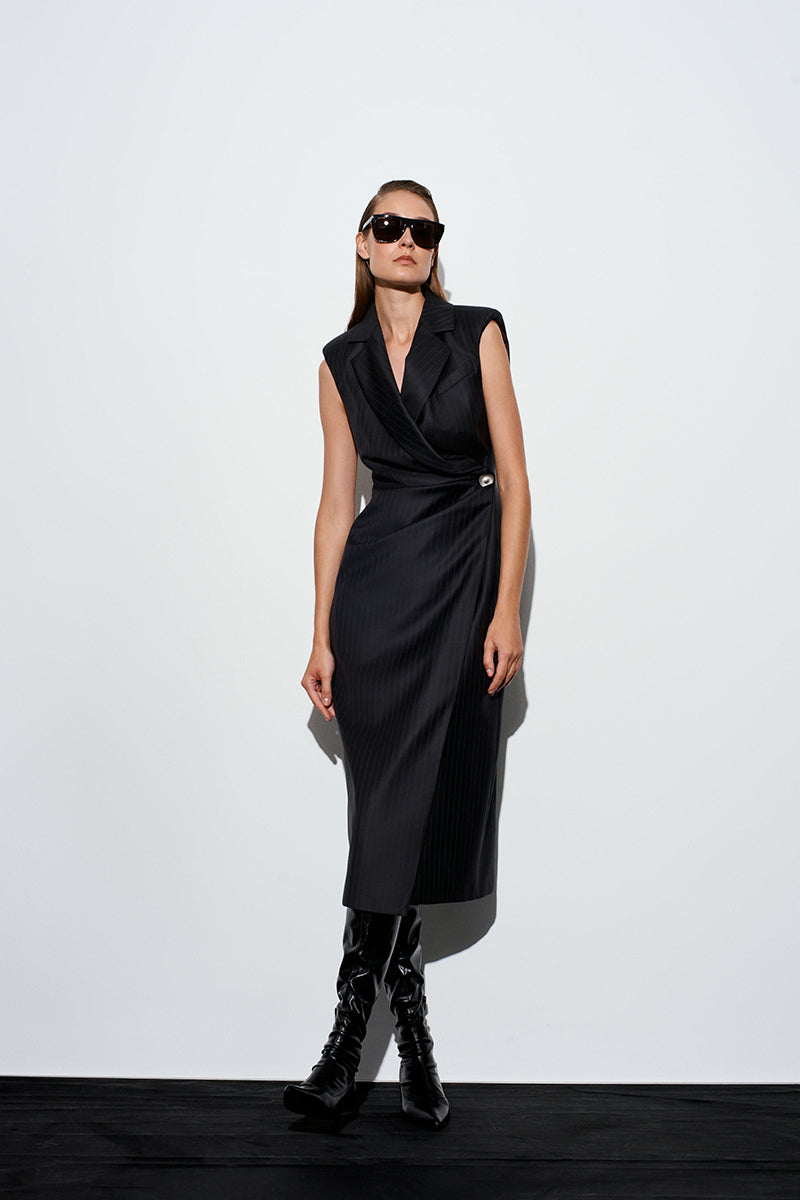 Black rotten dress midi from Acaria Studio featuring a distressed design and flowing fabric, styled as seen in the image.