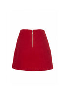 Chictopia Phoebe Mini Skirt in black with high waist and button detail, shown on a model against a neutral background.