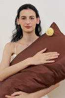 Brown silk pillowcase from Not Just Pajama's Tuscan Rose collection, showcasing smooth, luxurious fabric and elegant design.