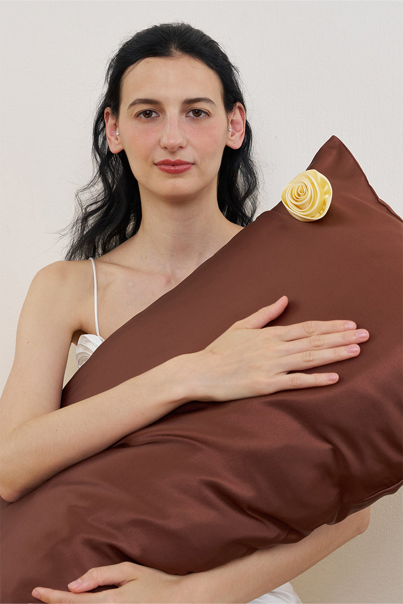 Brown silk pillowcase from Not Just Pajama's Tuscan Rose collection, showcasing smooth, luxurious fabric and elegant design.