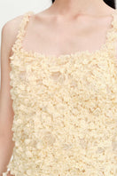 Beige Nora tank top from Chictopia, sleeveless casual top with a relaxed fit, displayed on a hanger.