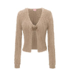 Beige rose cardigan by Chictopia, soft knit fabric with a relaxed fit, displayed on a hanger.