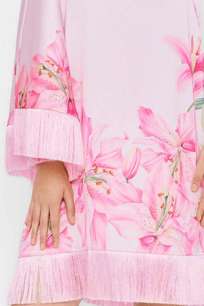 Valenciani pink one-shoulder mini dress showing the stylish asymmetrical neckline and fitted silhouette on a model.