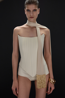 Beaded beige scarf by BALYKINA with intricate beadwork and soft fabric, draped to showcase its elegant design.