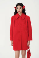 Chictopia ruby wool coat displayed on a hanger, showcasing its rich red color and classic tailored design.