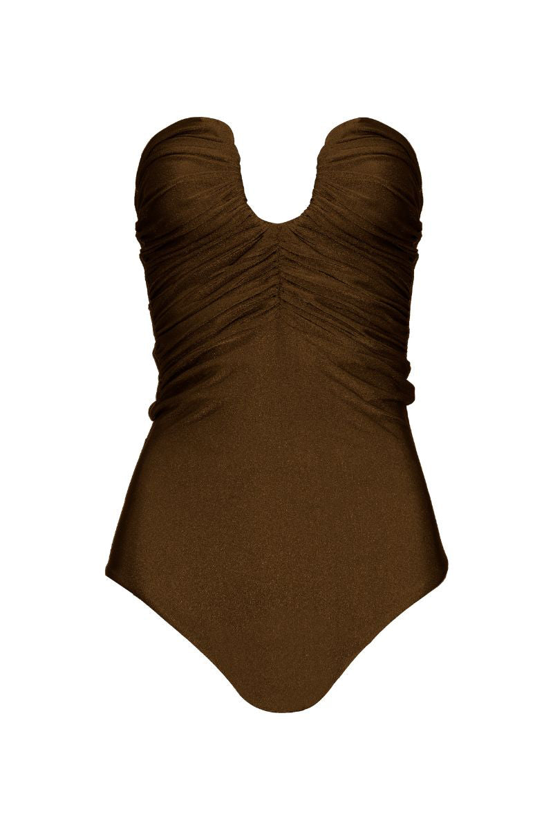 Brown Laura Escobar SERRANIA one-piece swimsuit with a sleek, fitted design, shown on a model against a neutral background.