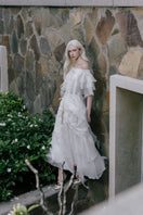 White Plan Thomas maxi dress featuring a flowing fabric and elegant design, perfect for casual or formal occasions.