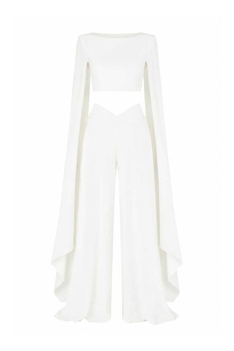 Lili Blanc sculpted wide trousers in lightweight fabric with a high waist and relaxed fit, displayed on a model.