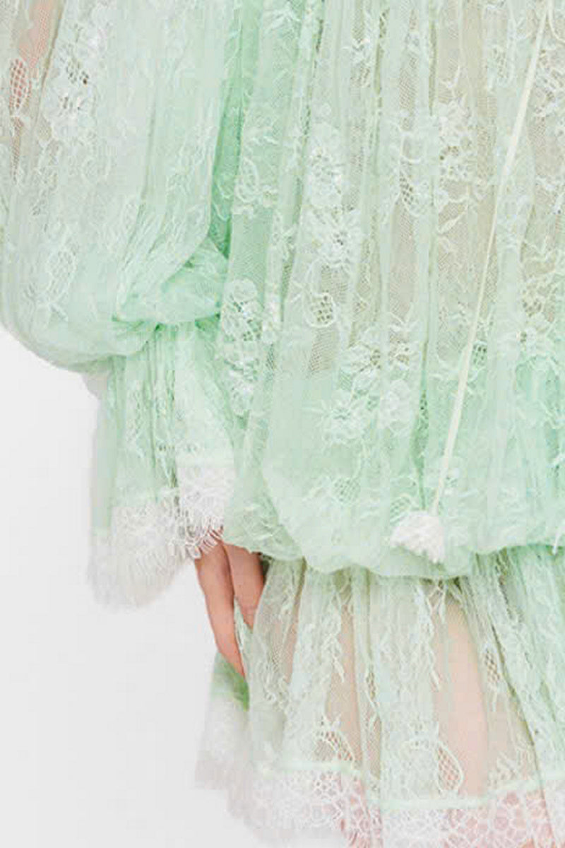 Valenciani off-shoulder lace mini dress with long sleeves and floral pattern, perfect for elegant evening wear.