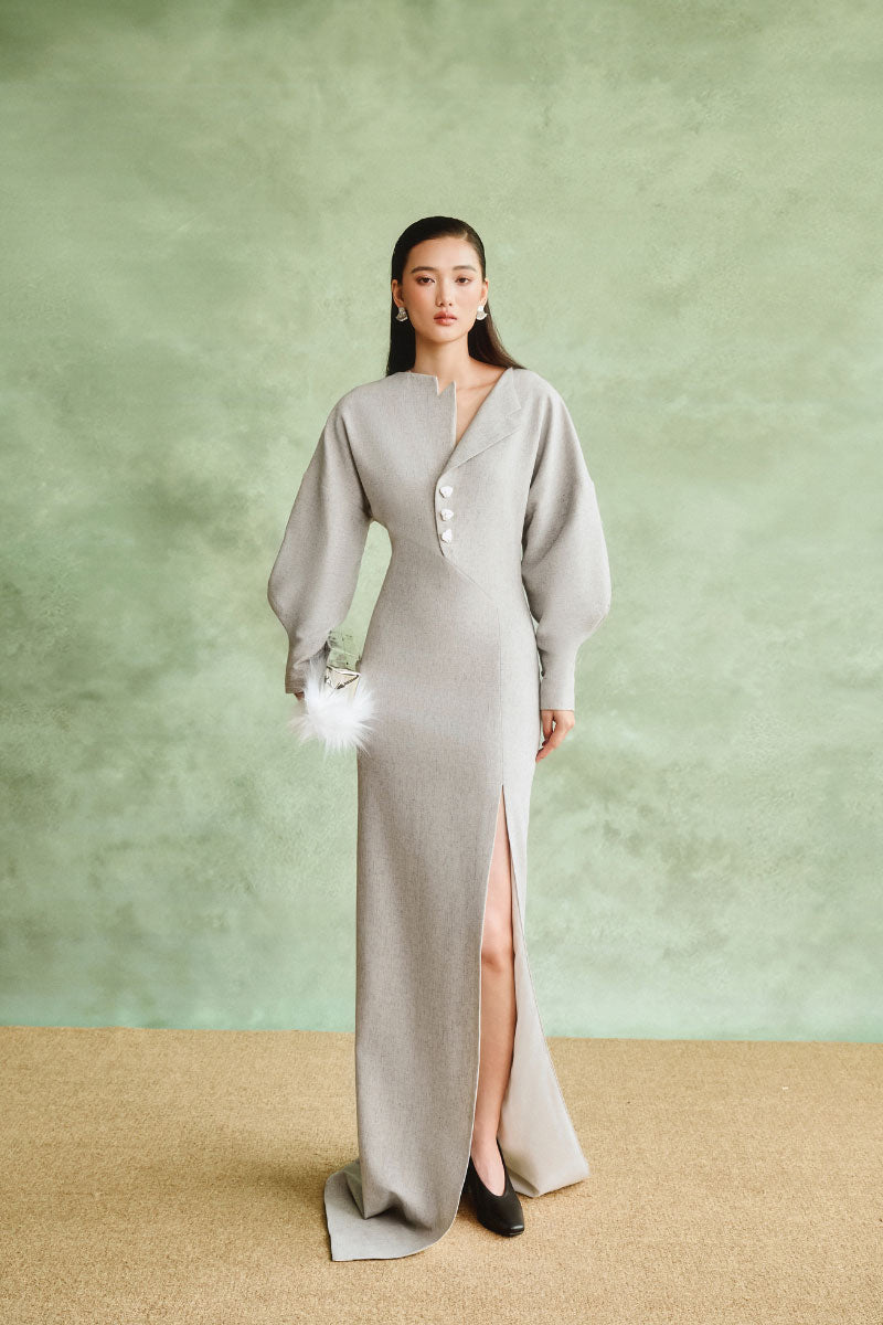 Gray sculptural maxi dress by White Plan, featuring flowing fabric and elegant design, perfect for stylish occasions.