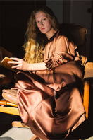 Brown silk custom gown robe by Not Just Pajama, showcasing smooth fabric and elegant design on a model.