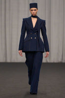 Lili Blanc double-breasted tailored denim blazer with notch lapel, front pockets, and structured fit, shown on a model.
