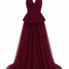 Lili Blanc burgundy floor-length evening gown with elegant fit, flowing fabric, and sophisticated style for formal occasions.