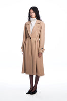 Beige pleated wool coat by Chictopia, featuring a tailored fit and classic design, displayed on a hanger against a neutral background.