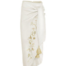 White gold Lilies pareo skirt by Estefania, midi length with flowing fabric and floral pattern, perfect for summer wear.
