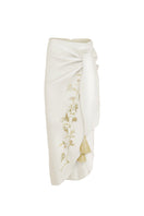 White gold Lilies pareo skirt by Estefania, midi length with flowing fabric and floral pattern, perfect for summer wear.