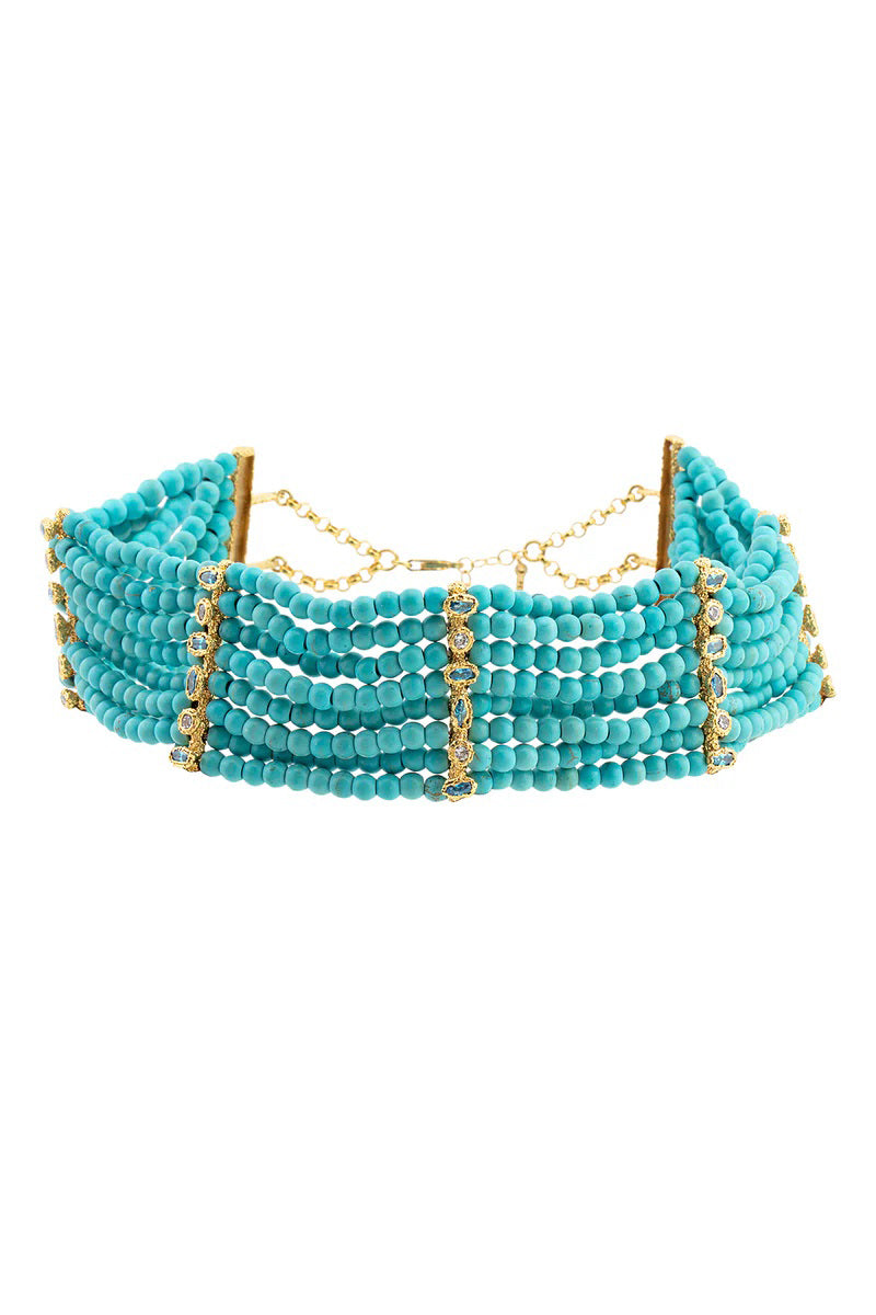 Peracas Patmos Waves Choker necklace with layered gold-tone marine-inspired design on a neutral background