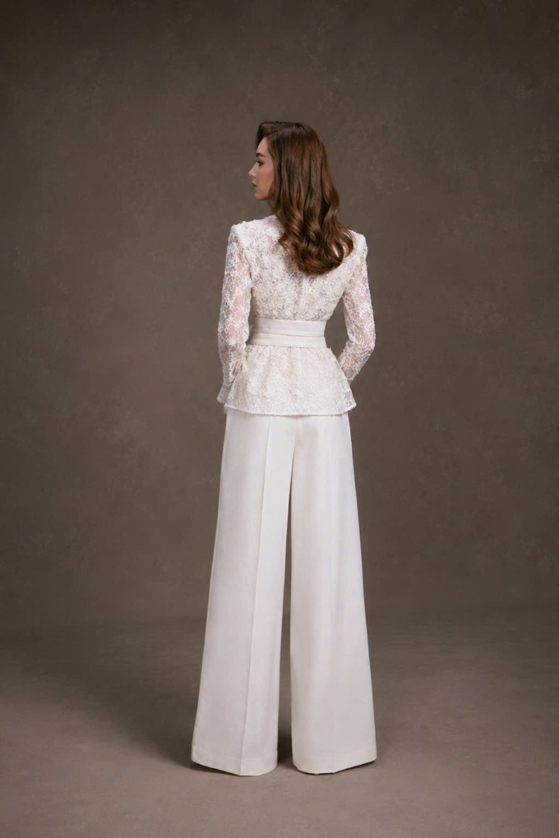 Keira Tong wide-leg pants in lightweight fabric, featuring a relaxed fit and high waist, shown in a neutral color.