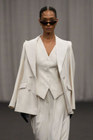 Lili Blanc chic sculpted sleeveless vest with a fitted design, displayed on a neutral background.