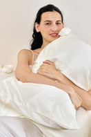 White Tuscan Rose silk pillowcase from Not Just Pajama, showcasing smooth fabric and elegant design for luxurious home decor.