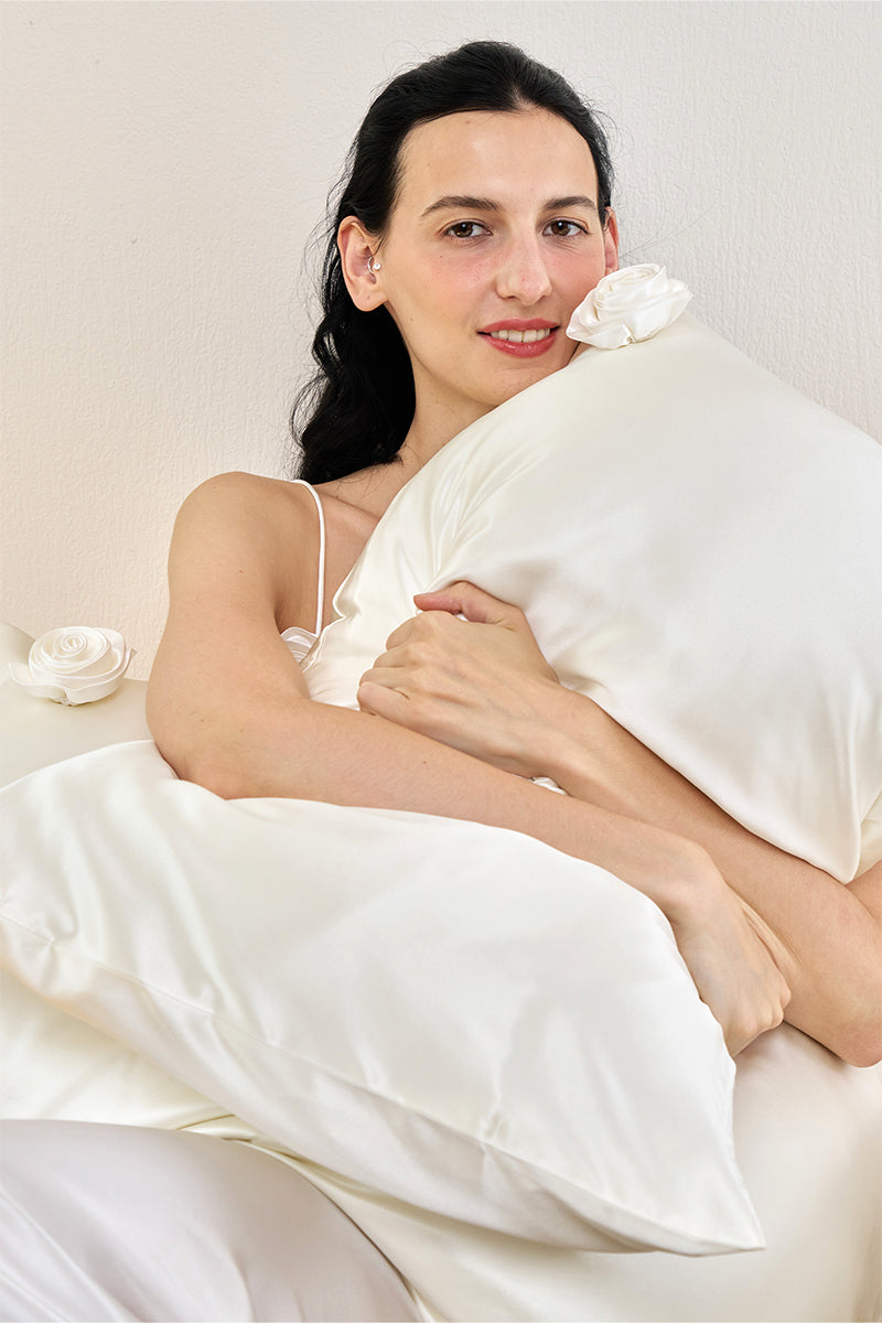 White Tuscan Rose silk pillowcase from Not Just Pajama, showcasing smooth fabric and elegant design for luxurious home decor.