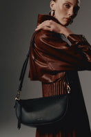 Black VIKELE STUDIO Denise Mini Bag shoulder bag with sleek, compact design and adjustable strap, perfect for everyday use.