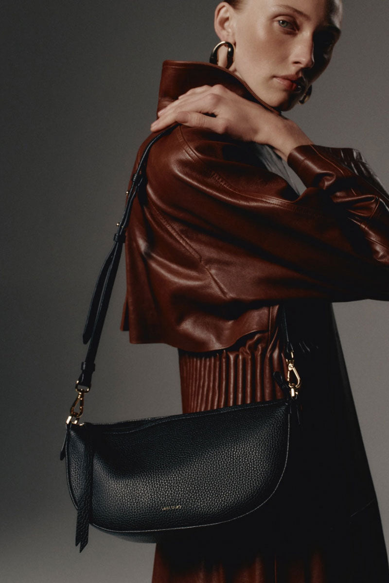 Black VIKELE STUDIO Denise Mini Bag shoulder bag with sleek, compact design and adjustable strap, perfect for everyday use.