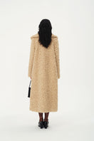 Chictopia Leona faux fur coat in plush beige with wide lapels and long sleeves, stylish winter outerwear for cold weather.