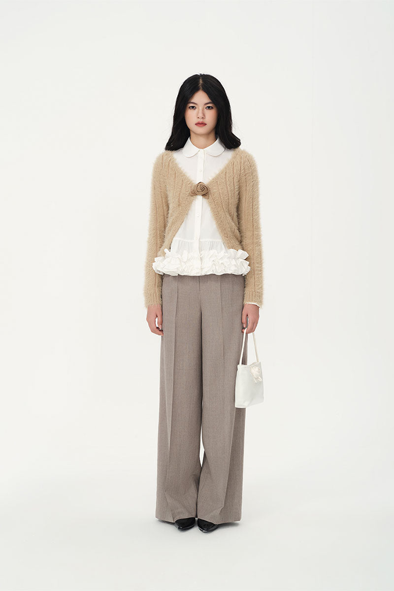 Beige rose-colored cardigan by Chictopia, featuring soft knit fabric and a relaxed fit, displayed on a hanger.