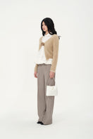 Chictopia Alma trousers, stylish pants with a fitted waist and tailored design, shown in a neutral color.