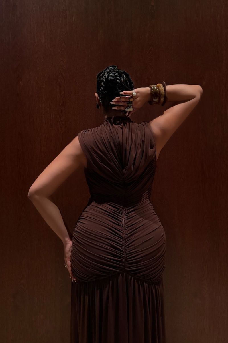 Khanum's brown maxi dress with flowing fabric and elegant design, perfect for casual or formal occasions.